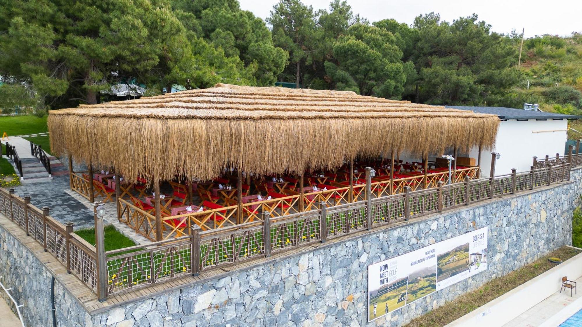 Ramada Resort Kusadasi & Golf Esterno foto Restaurant in the village
